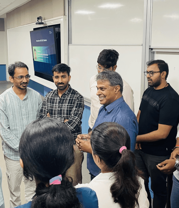 Students and faculty collaborating in an AI classroom